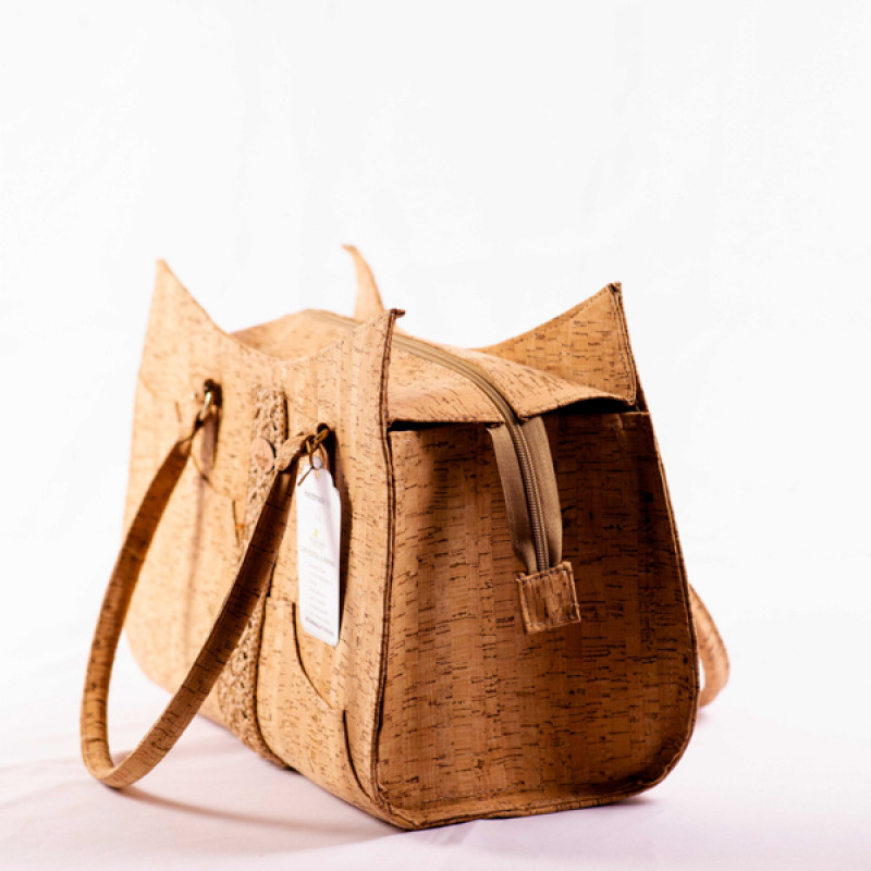 Lilah-Handbag embodies natural elegance with its unique combination of cork and crocheted raffia.